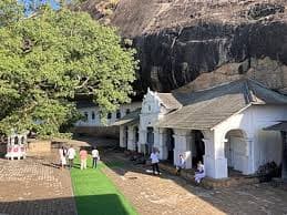 White cave temple entrance beneath the Dambulla rock