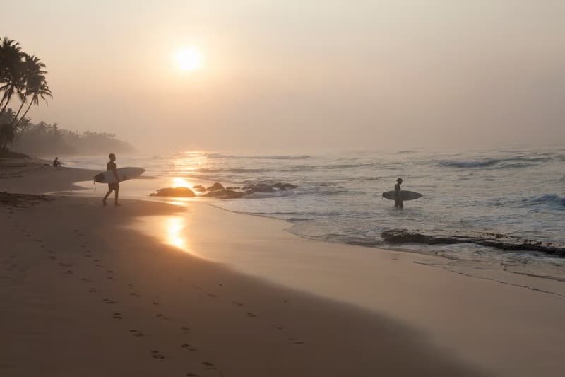 Surfing on the waves at Hikkaduwa