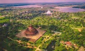Aerial view of an ancient stupa and the historic landscape of Anuradhapura